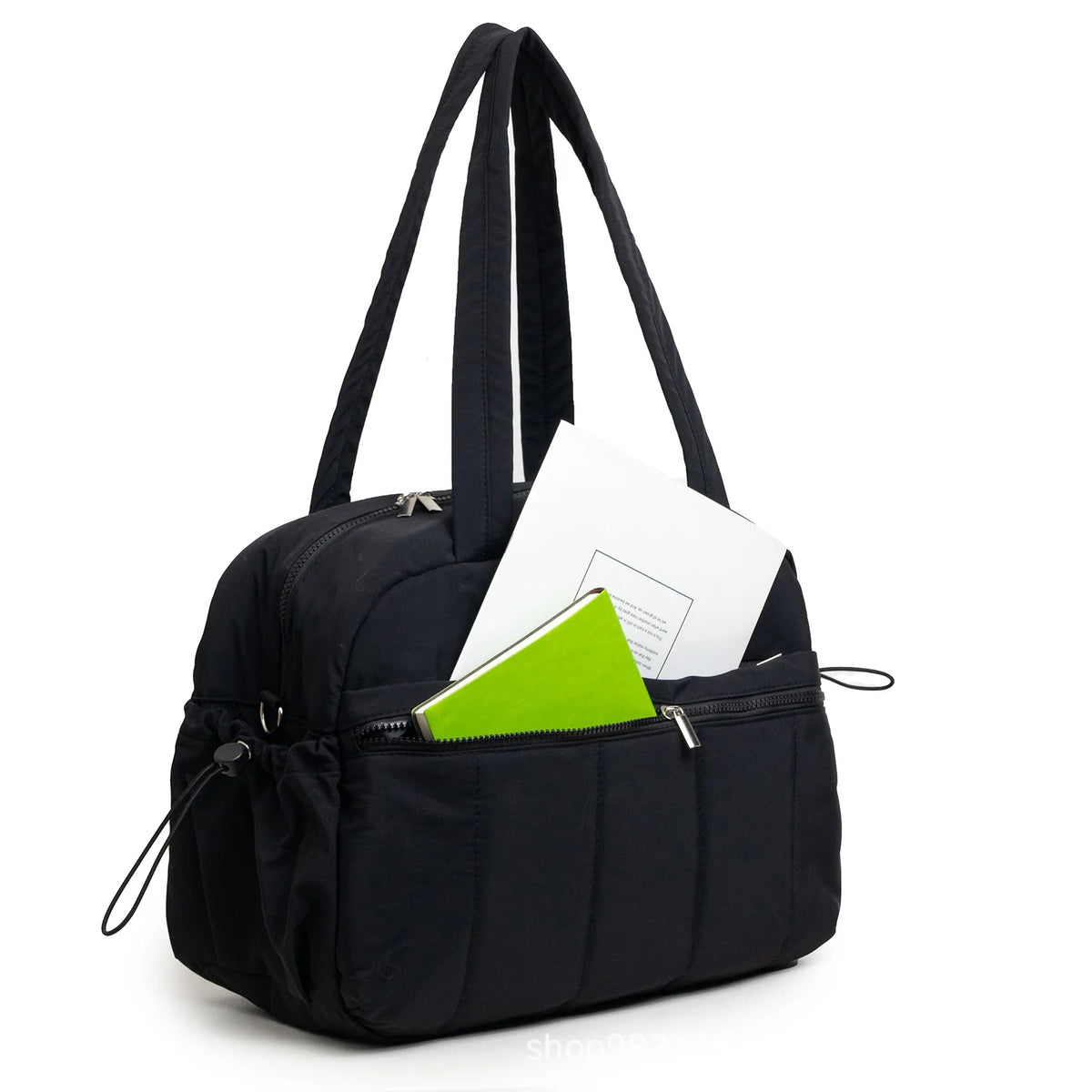 Kaya Sac à langer imperméable grande capacité noir face avec des livres dans les poches