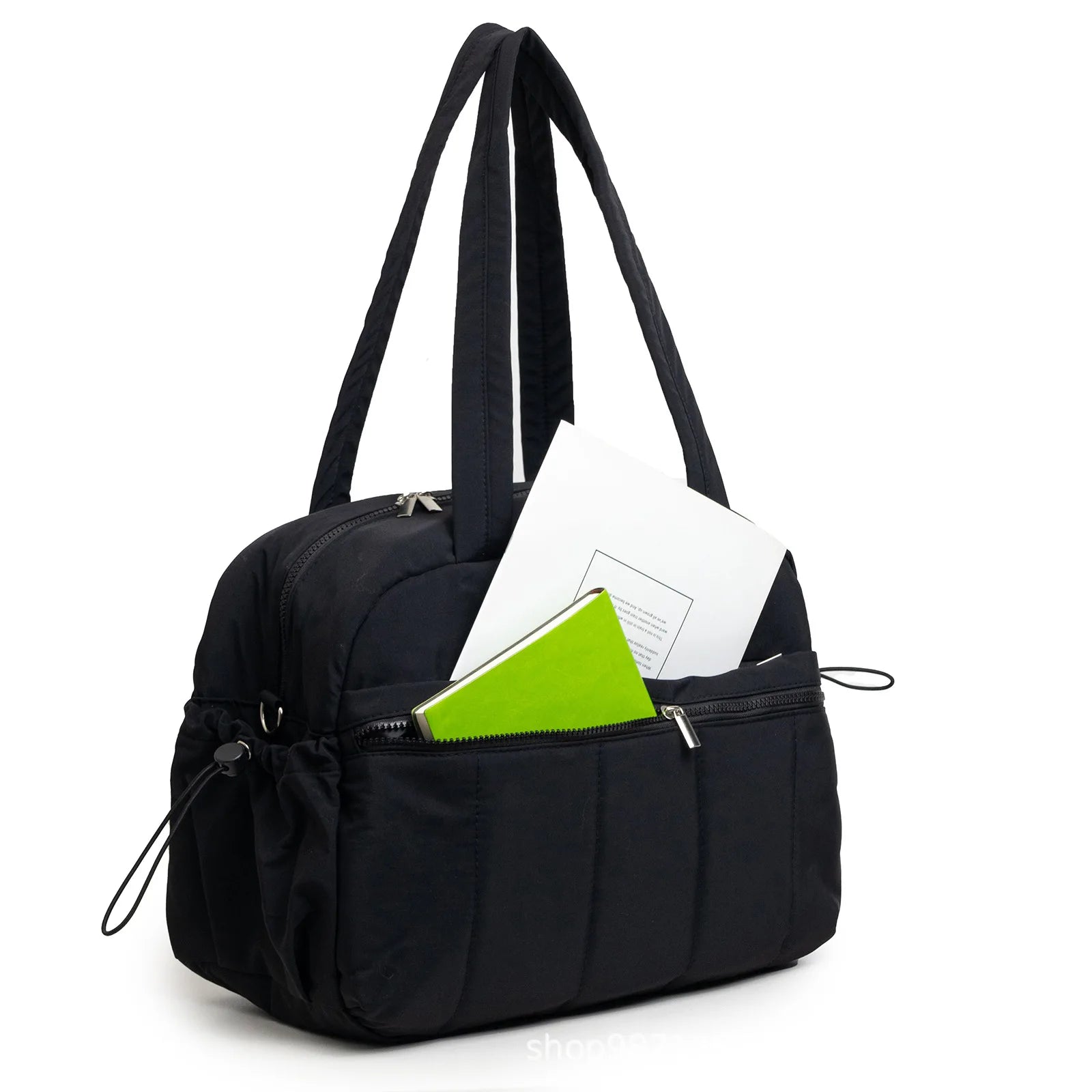 Kaya Sac à langer imperméable grande capacité noir face avec des livres dans les poches